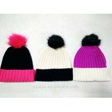 Ladies colorful knitted beanie with fake fur pom